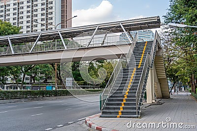 Overhead pedestrian crossing view of the stairs above the highway city road. Stock Photo