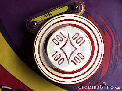 Overhead of 100-point bumper on retro pinball machine Stock Photo