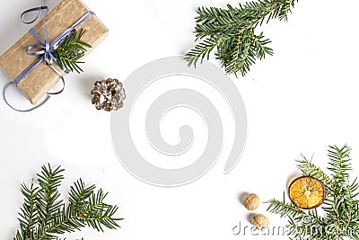 OVERHEAD RUSTIC HOMEMADE PRESENT BOX. CHRISTMAS ORNAMENTS ON WHITE BACKGROUND Stock Photo