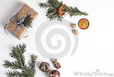 OVERHEAD RUSTIC HOMEMADE PRESENT BOX. CHRISTMAS ORNAMENTS ON WHITE BACKGROUND Stock Photo