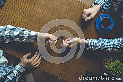 Overhead top view of two casual businessmen work in the office at table, toned Stock Photo