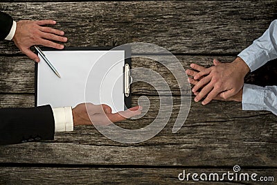 Overhead view of business employer an employee sitting at office Stock Photo