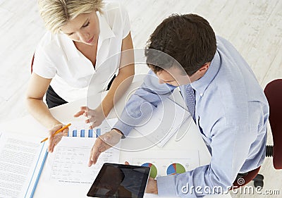 Overhead View Of Businesswoman And Businessman Working At Desk T Stock Photo