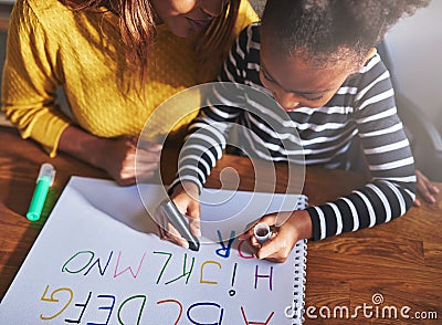 Overhead view of child learning alphabet Stock Photo