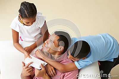 Overhead View Of Children Giving Father Gift Stock Photo