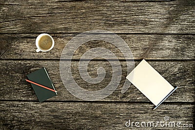 Overhead view of coffee, notebook and blank piece of paper Stock Photo