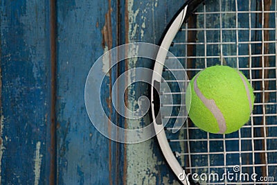 Overhead view of fluorescent yellow tennis ball on racket Stock Photo