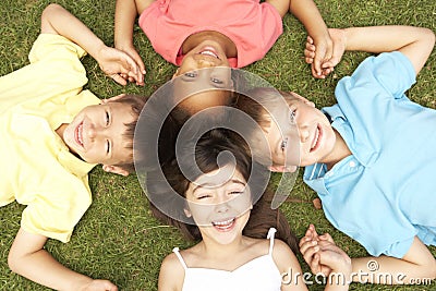 Overhead View Of Group Of Smiling Children Stock Photo