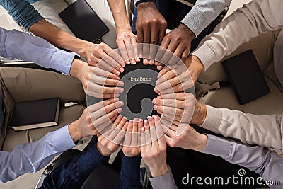 Hands Holding Holy Bible Stock Photo