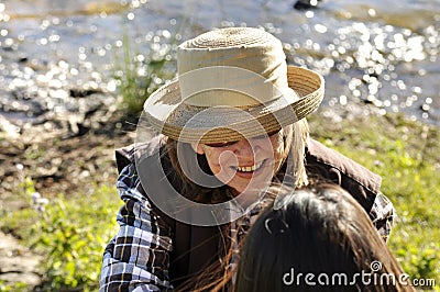 Overhead view of middle-aged woman in conversation smiling with friend Stock Photo