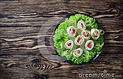 Overhead view of sliced sandwich wraps on skewers Stock Photo