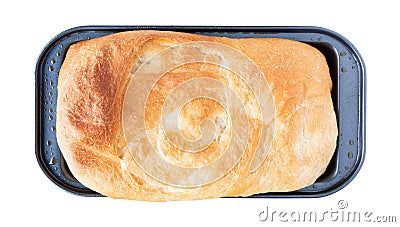 Overhead view of a small loaf of homemade bread in a metal pan isolated on a white background Stock Photo