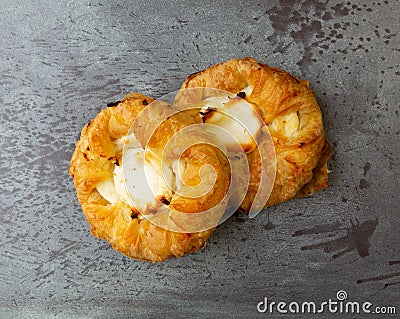 Top view of two delicious cream cheese danishes on a gray mottled tabletop Stock Photo