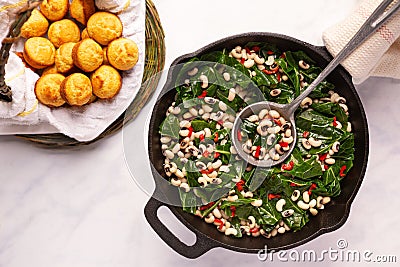 Close up of black-eye peas and collard greens Stock Photo