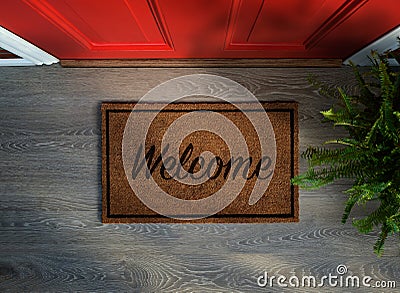 Overhead view of welcome mat outside inviting front door Stock Photo