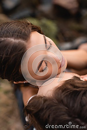 Overhead view of man kissing brunette Stock Photo