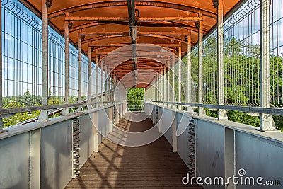 In an overhead walkway on a sunny day. Editorial Stock Photo