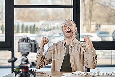 overjoyed businessman showing win gesture in Stock Photo