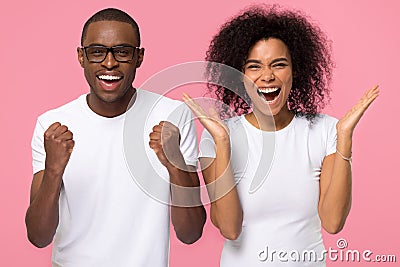 Overjoyed excited african american family couple winners celebrate victory Stock Photo