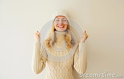 Overjoyed happy smiling woman doing winner gesture celebrate clenching fists say yes, caucasian female model 20s expressing Stock Photo