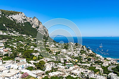 Overlooking view of Capri in Italy with a clear blue sky in the background Stock Photo