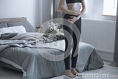 Overly thin girl on a scale Stock Photo