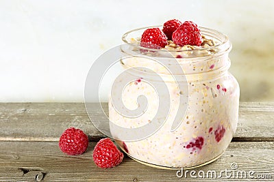 Overnight breakfast oats with raspberries Stock Photo