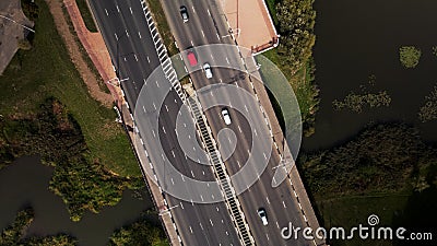 An overpass across the city river. Busy freeway. Aerial photography Stock Photo