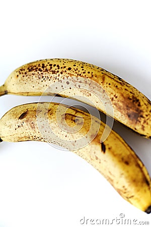 Overripe bananas on a white background. Ripe yellow fruit Stock Photo