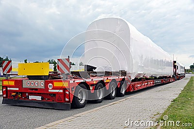 Very long vehicle. Oversize load or exceptional convoy. A truck with a special semi-trailer for transporting oversized loads Stock Photo