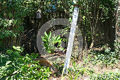 Oversized quicksilver thermometer in the blazing sun Stock Photo