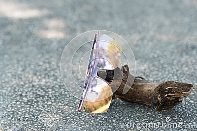 Oversized sunglasses model with big pink lenses shoot in a summer day close up. Selective focus Stock Photo