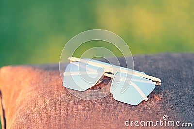 Oversized sunglasses model with blue lenses closeup . Selective focus Stock Photo