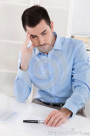 Overstrained and overworked businessman with headache: Portrait Stock Photo