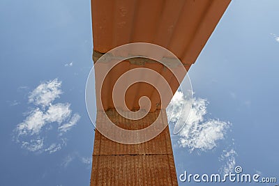 Overthrow with red construction blocks under blue sky with crane Stock Photo
