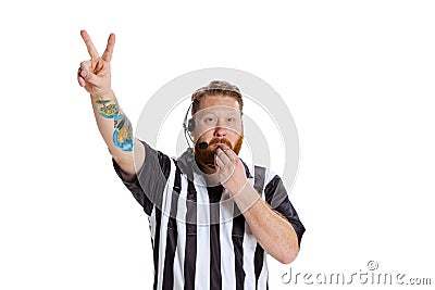 Half-length portrait of sport referee wearing field judge uniform gesturing isolated on white studio background. Concept Stock Photo