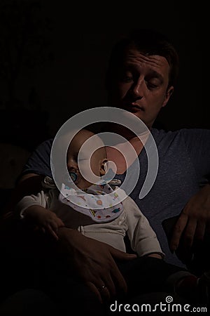 Overtired single father with his son Stock Photo