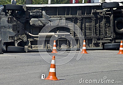 Overturned transport on accident site with traffic cones Stock Photo