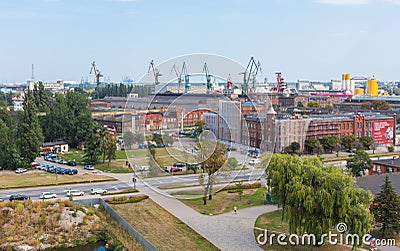 Overview of the city Gdansk and the heavy cranes of the Shipyard. Editorial Stock Photo