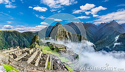 Overview of Machu Picchu, agriculture terraces and Wayna Picchu peak in the background Stock Photo