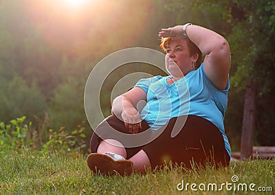 Overweight hiker woman relaxing. Stock Photo