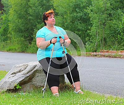 Overweight hiker woman relaxing. Stock Photo