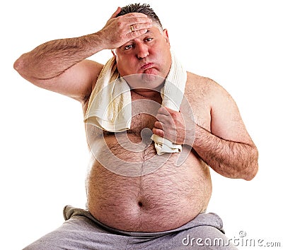 Overweight man resting, tired after training, with hand on forehead Stock Photo