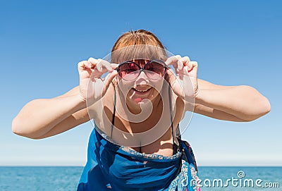 Overweight middle aged woman at the sea Stock Photo