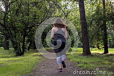 Overweight woman back running. Weight loss concept Stock Photo