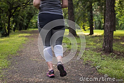 Overweight woman back running. Weight loss concept Stock Photo