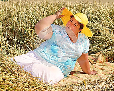 Overweight woman enjoying life during summer vacations. Stock Photo