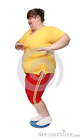 Overweight woman on gymnastic disc Stock Photo