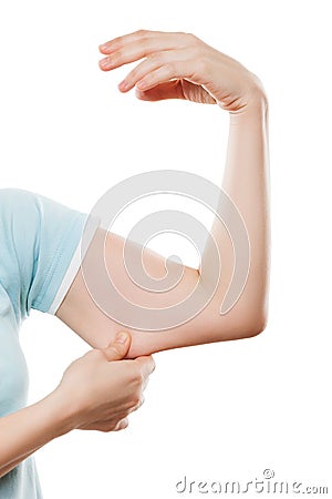 Overweight woman hand holding or pinching weak flabby triceps mu Stock Photo