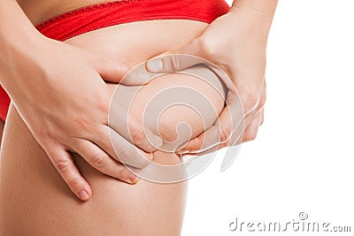 Overweight woman holding or pinching fat body bottom or buttocks Stock Photo